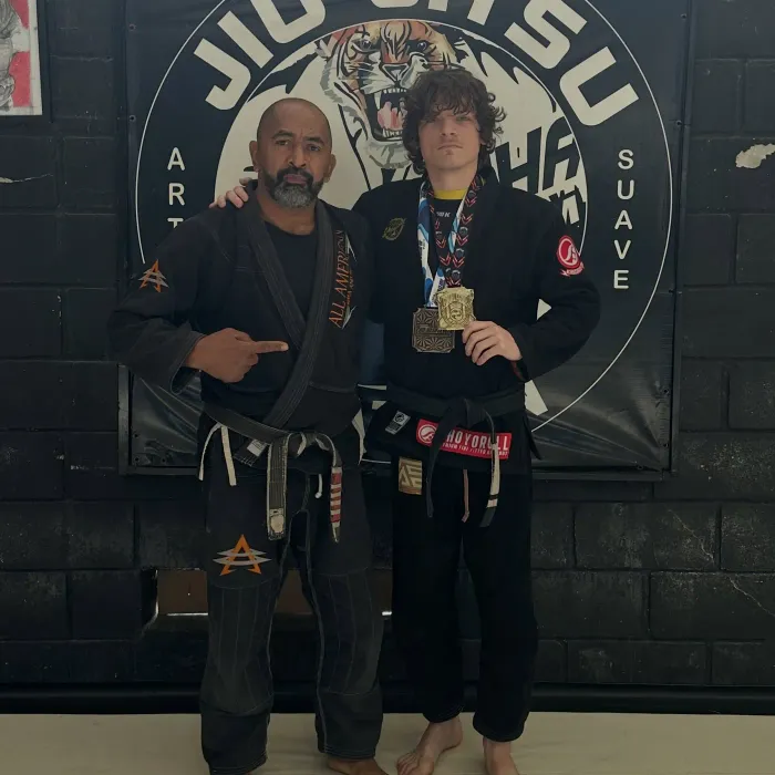 Tyler with his coach in Brazil