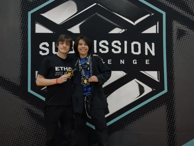 Ethos athlete holding competition medals