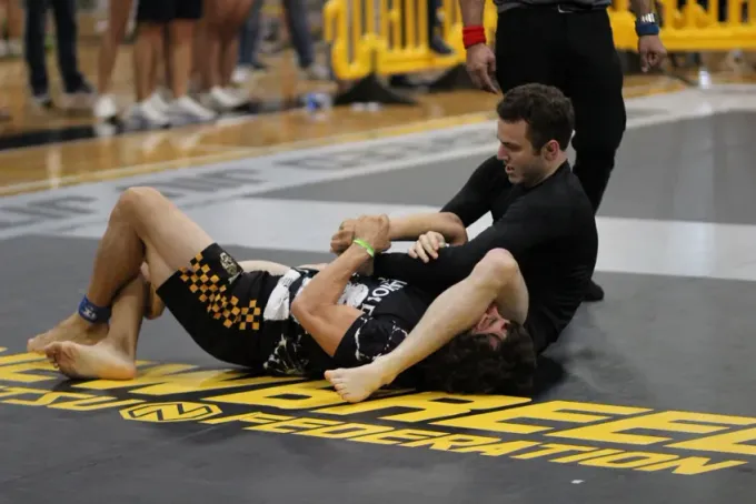 Rolling during class at Ethos BJJ
